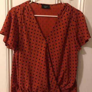 Red and black polka dot blouse